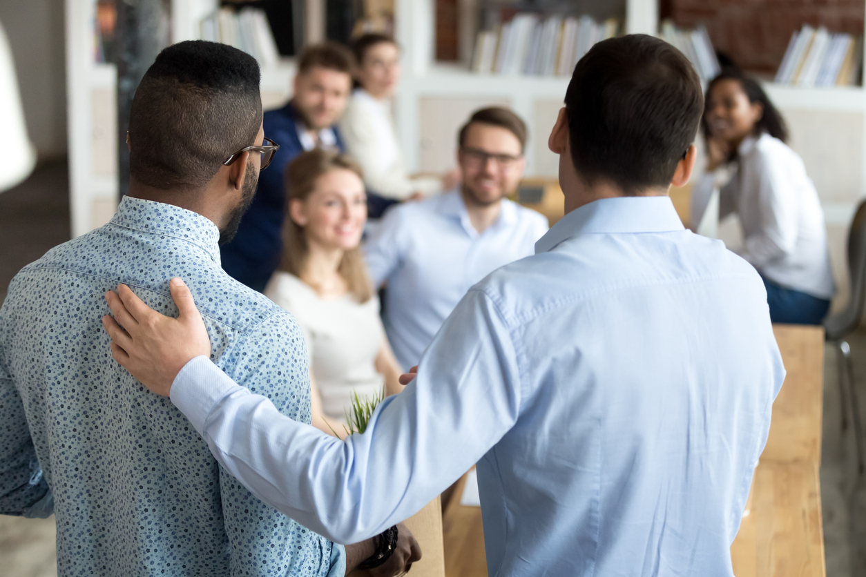 Boss introducing new worker to workmates Boss introducing new worker to workmates