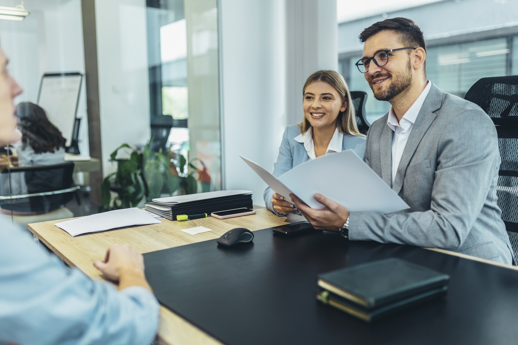 Image of a team doing an interview for a new hire.<br />